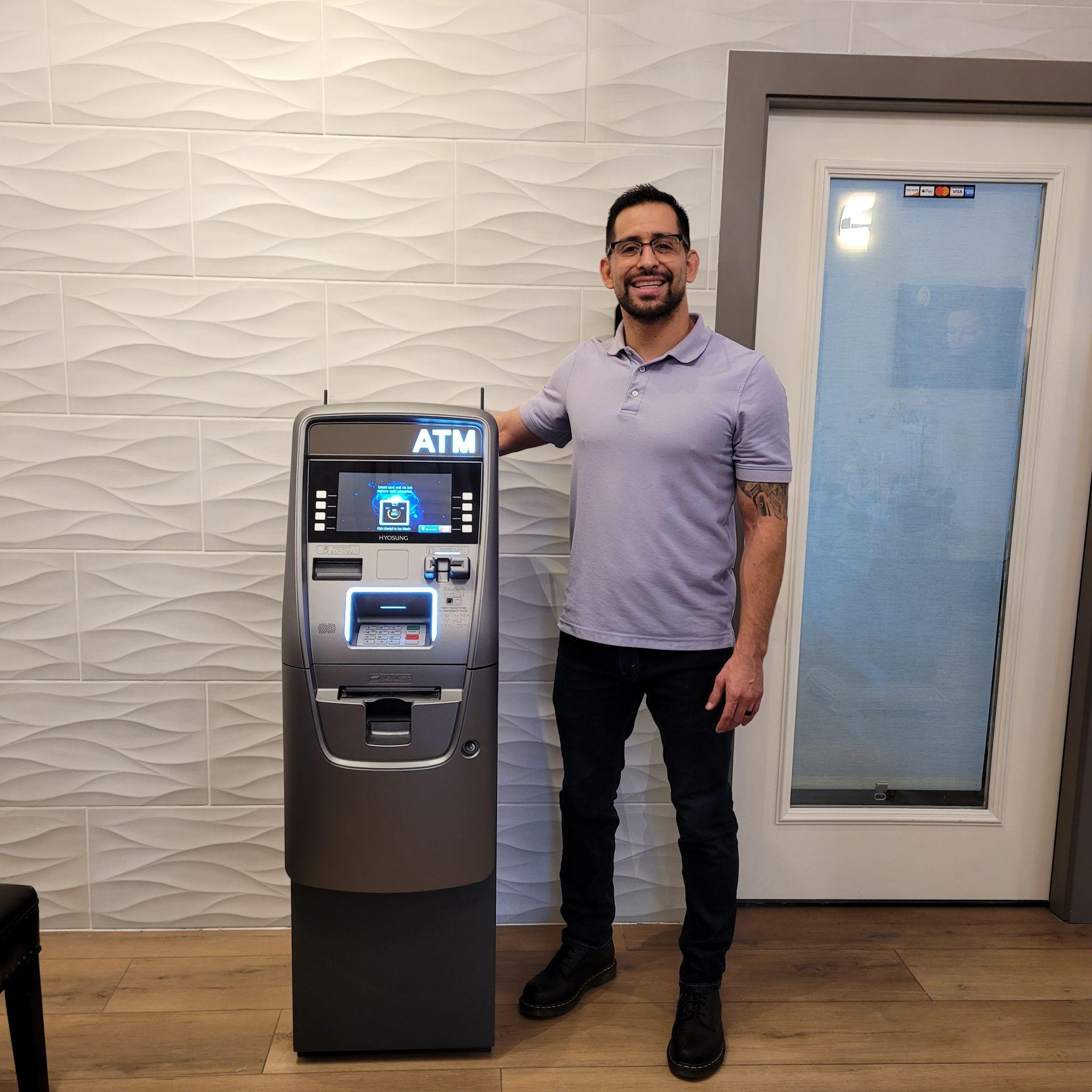 Owner of The DoughMan ATM standing proudly next to one of our installed ATM machines. Specializing in ATM placement and services for small and medium-sized businesses, we help local businesses enhance customer convenience and increase revenue